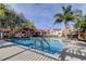 This pool is surrounded by beautiful palm trees and lush landscaping at 9481 Highland Oak Dr # 1308, Tampa, FL 33647