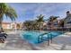 This pool is surrounded by beautiful palm trees and lush landscaping at 9481 Highland Oak Dr # 1308, Tampa, FL 33647