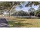 A fenced outdoor tennis court, perfect for recreational play and enjoying the outdoors at 9481 Highland Oak Dr # 1308, Tampa, FL 33647