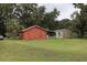 Spacious backyard with lawn and utility shed at 1006 Gray St, Plant City, FL 33563
