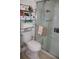 Functional bathroom features a toilet, shower, and storage shelf at 1006 Gray St, Plant City, FL 33563
