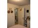 Bedroom shows doorway to dining area, decorated door, and storage cabinet at 1006 Gray St, Plant City, FL 33563