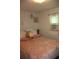 Cozy bedroom features comfortable bedding, bright window, and charming decor at 1006 Gray St, Plant City, FL 33563