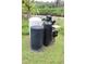 Outside well system with multiple tanks and components on a grassy lot at 1006 Gray St, Plant City, FL 33563