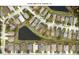 Aerial view of the neighborhood showing the layout of homes and proximity to the pond at 10109 36Th E Ct, Parrish, FL 34219