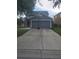 Frontal exterior view of a home boasting a spacious driveway, two-car garage, and a basketball hoop at 10109 36Th E Ct, Parrish, FL 34219
