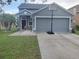 Inviting single-Gathering home with a two-car garage, manicured lawn, and a basketball hoop at 10109 36Th E Ct, Parrish, FL 34219