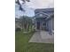 A home with a manicured lawn, palm trees, rock features, and chairs on the front porch at 10109 36Th E Ct, Parrish, FL 34219