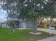 Charming two-story home with a landscaped yard and a large tree providing ample shade at 10109 36Th E Ct, Parrish, FL 34219