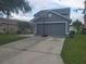 Spacious two-car garage with a driveway featuring a basketball hoop at 10109 36Th E Ct, Parrish, FL 34219