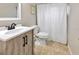 Bathroom with a modern vanity, stylish fixtures, and a tiled shower and floors at 10811 Providence Oaks Dr, Riverview, FL 33578