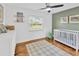 Bedroom featuring wood floors, a crib, and cheerful wall decor at 10811 Providence Oaks Dr, Riverview, FL 33578