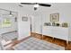 Bedroom with hardwood floors, built-in drawers, and a large closet at 10811 Providence Oaks Dr, Riverview, FL 33578