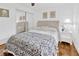Comfortable bedroom with mirrored closet doors and a tufted headboard at 10811 Providence Oaks Dr, Riverview, FL 33578