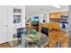 Open-concept dining area showcasing modern furnishings, hardwood floors, and direct view to the kitchen and living room at 10811 Providence Oaks Dr, Riverview, FL 33578