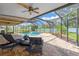 Lovely pool area with brick patio and a covered screen at 10811 Providence Oaks Dr, Riverview, FL 33578