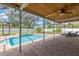 Gorgeous screened-in pool and deck area with a beautiful bamboo ceiling at 10811 Providence Oaks Dr, Riverview, FL 33578