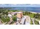 An aerial view showcases the building nestled near a park, a beach, and local amenities at 1120 N Shore Ne Dr # 503, St Petersburg, FL 33701