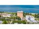 Aerial view showcasing the building near a park and tennis courts, beaches, and beautiful blue waters at 1120 N Shore Ne Dr # 503, St Petersburg, FL 33701