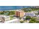 An aerial view shows the building with its proximity to the beach, the waters, and downtown, offering stunning views at 1120 N Shore Ne Dr # 503, St Petersburg, FL 33701
