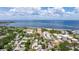 An aerial view showing the building and the serene coastline with sparkling waters, beautiful beaches, and a tranquil environment at 1120 N Shore Ne Dr # 503, St Petersburg, FL 33701
