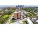 An aerial view shows the building and its proximity to downtown, surrounded by lush trees and green spaces at 1120 N Shore Ne Dr # 503, St Petersburg, FL 33701