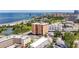 An aerial view shows the building with its proximity to the beach, the waters, and downtown, offering stunning views at 1120 N Shore Ne Dr # 503, St Petersburg, FL 33701