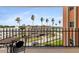 Balcony view of buildings and landscape with seating in a tropical community at 1120 N Shore Ne Dr # 503, St Petersburg, FL 33701