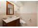 Stylish bathroom with wood vanity, marble countertop, and tiled walls offers a clean and updated design at 1120 N Shore Ne Dr # 503, St Petersburg, FL 33701