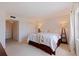 Spacious bedroom features neutral carpet, a queen bed, and ample closet space for organized storage at 1120 N Shore Ne Dr # 503, St Petersburg, FL 33701