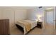 Well-lit bedroom featuring neutral carpet, a cozy bed, and ample closet space for organized living at 1120 N Shore Ne Dr # 503, St Petersburg, FL 33701