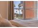 Relaxing bedroom window view of palm trees and neighborhood seen from a plush bed at 1120 N Shore Ne Dr # 503, St Petersburg, FL 33701