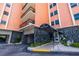 Exterior entrance with a covered awning and stone facade detail reads 'The Normandy' at 1120 N Shore Ne Dr # 503, St Petersburg, FL 33701