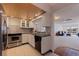 Efficient kitchen featuring stainless steel appliances with an open layout to the living room at 1120 N Shore Ne Dr # 503, St Petersburg, FL 33701