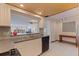 Bright kitchen with granite countertops, modern appliances, and an open view to the living area at 1120 N Shore Ne Dr # 503, St Petersburg, FL 33701