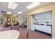 Kitchenette in community room featuring white cabinetry, sink, and microwave for resident use at 1120 N Shore Ne Dr # 503, St Petersburg, FL 33701