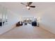 Spacious living room featuring neutral walls, carpet, and a view from the balcony at 1120 N Shore Ne Dr # 503, St Petersburg, FL 33701