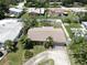 Aerial view of a home with mature trees and fenced yard at 11460 Park Blvd, Seminole, FL 33772