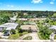 Aerial view of single Gathering home with mature trees and fenced yard at 11460 Park Blvd, Seminole, FL 33772