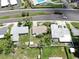 Aerial view of a home with lush yard near the highway at 11460 Park Blvd, Seminole, FL 33772