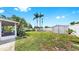 Spacious backyard with lush lawn and palm trees at 11460 Park Blvd, Seminole, FL 33772