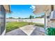 Fenced backyard with lush green lawn and white storage shed at 11460 Park Blvd, Seminole, FL 33772