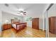 Bright bedroom with hardwood floors, ceiling fan, and natural light at 11460 Park Blvd, Seminole, FL 33772