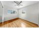 Bedroom with hardwood floors, ceiling fan, and natural light at 11460 Park Blvd, Seminole, FL 33772