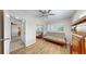 Bedroom with hardwood floors, ceiling fan, lots of natural light, and matching wood furniture at 11460 Park Blvd, Seminole, FL 33772