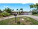 A cozy home with mature landscaping, a mailbox, and a paved driveway at 11460 Park Blvd, Seminole, FL 33772