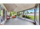 Enclosed lanai featuring an outdoor view of tropical foliage and a concrete patio at 11460 Park Blvd, Seminole, FL 33772