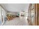 Open living space offering tile flooring, access to the lanai, and access to dining area at 11460 Park Blvd, Seminole, FL 33772