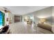 Spacious living room features neutral walls, tile floors, and large sliding glass doors to lanai at 11460 Park Blvd, Seminole, FL 33772