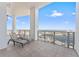 This condo features a large balcony with lounge chairs and water views at 1209 E Cumberland Ave # 2703, Tampa, FL 33602